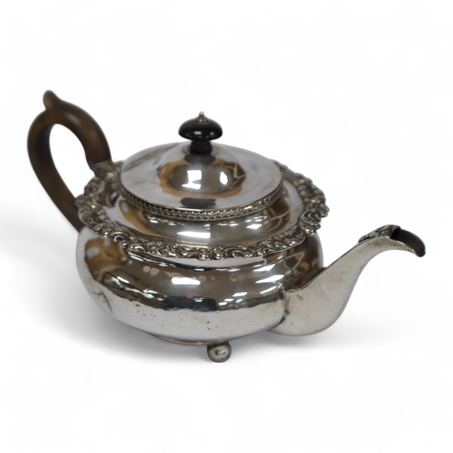 An early 19th century silver circular teapot, marks rubbed, by Thomas Blagden & Co, Sheffield, circa 1820, gross weight 22oz. Condition - poor